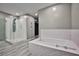 Bathroom with soaking tub and walk-in shower at 10226 Jade Gardens Dr, Las Vegas, NV 89135