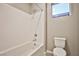 Clean bathroom with a shower/tub combo and bright window at 10226 Jade Gardens Dr, Las Vegas, NV 89135