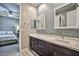 Spa-like bathroom with a double vanity and geometric tile at 10226 Jade Gardens Dr, Las Vegas, NV 89135