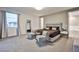 Elegant main bedroom with two armchairs and ensuite at 10226 Jade Gardens Dr, Las Vegas, NV 89135