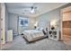 Cozy bedroom with a tufted headboard and ceiling fan at 10226 Jade Gardens Dr, Las Vegas, NV 89135