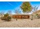 Oak Leaf Park community entrance with stone and metal signage at 10226 Jade Gardens Dr, Las Vegas, NV 89135