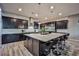 Modern kitchen with stainless steel appliances, large island, and ample counter space at 10226 Jade Gardens Dr, Las Vegas, NV 89135