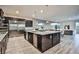 Island kitchen with stainless steel appliances and granite countertops at 10226 Jade Gardens Dr, Las Vegas, NV 89135