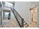 Modern staircase with metal railing and a half-bathroom visible at 10226 Jade Gardens Dr, Las Vegas, NV 89135