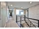 Upper hallway with open view and modern metal railing at 10226 Jade Gardens Dr, Las Vegas, NV 89135