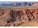 Aerial view of red rock mountains and desert landscape at 10229 Birch Bluff Ln, Las Vegas, NV 89145