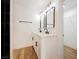 Modern bathroom with white cabinets, quartz countertops, and black accents at 10229 Birch Bluff Ln, Las Vegas, NV 89145