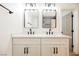 Modern bathroom with white cabinets, quartz countertops, and black accents at 10229 Birch Bluff Ln, Las Vegas, NV 89145