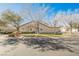 Single-story home with a well-maintained lawn and landscaping at 10229 Birch Bluff Ln, Las Vegas, NV 89145