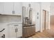 Stainless steel refrigerator in a modern kitchen with white cabinets at 10229 Birch Bluff Ln, Las Vegas, NV 89145