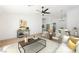 Virtually staged living room features a neutral color palette, modern furniture, and hardwood floors at 10229 Birch Bluff Ln, Las Vegas, NV 89145