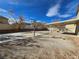 Large backyard with covered patio and basketball court at 1113 Dawn Valley Dr, North Las Vegas, NV 89031