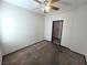 Well-lit bedroom with ceiling fan and carpet at 1113 Dawn Valley Dr, North Las Vegas, NV 89031