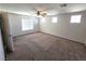 Bright bedroom featuring a large window and ceiling fan at 1113 Dawn Valley Dr, North Las Vegas, NV 89031