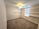 Bedroom with ceiling fan, carpet, and shelving at 1113 Dawn Valley Dr, North Las Vegas, NV 89031