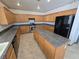 Kitchen with granite countertops and wooden cabinets at 1113 Dawn Valley Dr, North Las Vegas, NV 89031