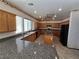 Kitchen with granite countertops and wooden cabinets at 1113 Dawn Valley Dr, North Las Vegas, NV 89031