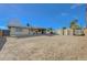 Backyard with sheds and the exterior of the house at 1212 Reynolds Ave, North Las Vegas, NV 89030