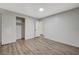 Bedroom featuring a closet with wood-look flooring and neutral color palette at 1212 Reynolds Ave, North Las Vegas, NV 89030