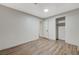 This bedroom features wood-look flooring and a spacious closet at 1212 Reynolds Ave, North Las Vegas, NV 89030