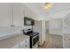 Modern kitchen with stainless steel appliances and white cabinets at 1212 Reynolds Ave, North Las Vegas, NV 89030