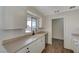 Clean and efficient kitchen featuring white cabinetry at 1212 Reynolds Ave, North Las Vegas, NV 89030