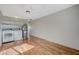 This laundry room features wood flooring, shelves, and a washer/dryer at 1212 Reynolds Ave, North Las Vegas, NV 89030