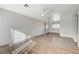 Bright living room featuring new floors, neutral paint, ceiling fan and abundant natural light at 1212 Reynolds Ave, North Las Vegas, NV 89030