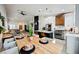 Kitchen with open concept dining area and a large wooden table at 140 Cora Hills Ct, Las Vegas, NV 89148