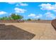 Spacious backyard with gravel and a block wall at 1606 Dire Wolf Ave, North Las Vegas, NV 89084