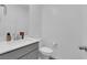 Clean bathroom with gray vanity, white countertop, and a toilet at 1606 Dire Wolf Ave, North Las Vegas, NV 89084