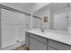 Bathroom with gray vanity, a shower, and a toilet at 1606 Dire Wolf Ave, North Las Vegas, NV 89084