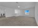 Spacious bonus room with large window and carpet flooring at 1606 Dire Wolf Ave, North Las Vegas, NV 89084