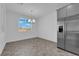 Bright breakfast nook with gray tile floor and a view to the backyard at 1606 Dire Wolf Ave, North Las Vegas, NV 89084