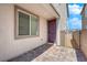 Front door entry with paver walkway and side yard access at 1606 Dire Wolf Ave, North Las Vegas, NV 89084