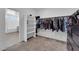 Large walk-in closet with shelving and hanging rods at 1606 Dire Wolf Ave, North Las Vegas, NV 89084