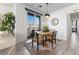 Bright dining area with a wooden table and access to a balcony at 20 Red Oak Canyon St # 3, Henderson, NV 89012