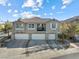 Three-car garage and inviting exterior of a two-story townhome at 20 Red Oak Canyon St # 3, Henderson, NV 89012