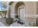 Inviting front door entrance with potted plants at 20 Red Oak Canyon St # 3, Henderson, NV 89012