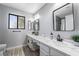 Bathroom with double vanity, quartz countertops and modern fixtures at 2039 Waverly Cir, Henderson, NV 89014