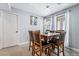 Dining room with a wood table and six leather chairs at 2039 Waverly Cir, Henderson, NV 89014