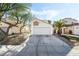 House exterior with a two-car garage and landscaping at 2039 Waverly Cir, Henderson, NV 89014