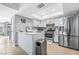 Modern kitchen with island, stainless steel appliances, and white cabinets at 2039 Waverly Cir, Henderson, NV 89014