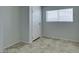 Simple bedroom with tile floors and a closet at 2108 Kirk Ave, Las Vegas, NV 89101