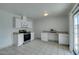 Bright kitchen features white cabinets, granite counters, and stainless steel appliances at 2108 Kirk Ave, Las Vegas, NV 89101