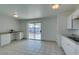 Bright kitchen features white cabinets, granite counters, and stainless steel appliances at 2108 Kirk Ave, Las Vegas, NV 89101