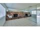 Living room with brick fireplace and mirrored walls at 2108 Kirk Ave, Las Vegas, NV 89101