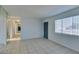 Bright living room features tile floors and a brick fireplace at 2108 Kirk Ave, Las Vegas, NV 89101