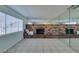 Living room with brick fireplace and mirrored wall at 2108 Kirk Ave, Las Vegas, NV 89101